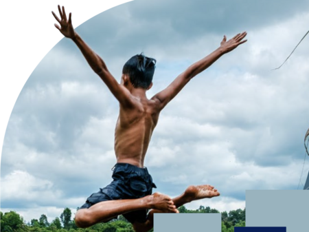 Child jumping into a lake with arrow overlaid to symbolise progress